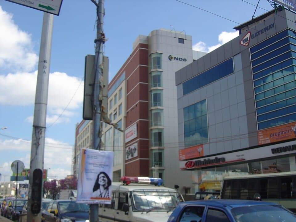 Shops and offices lining a busy junction in Koramangala, Bengaluru