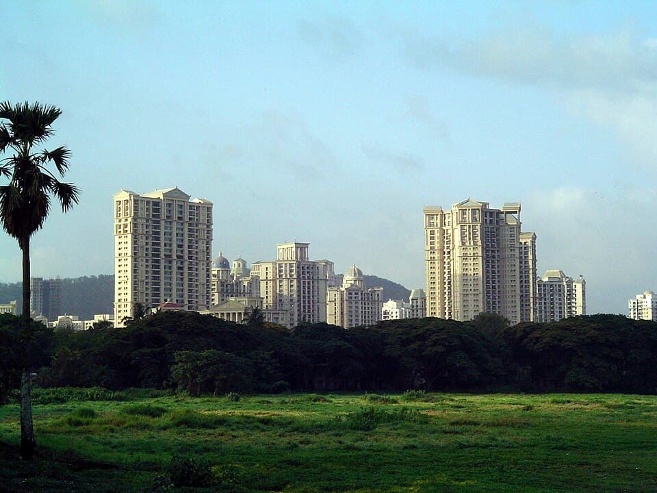 High-rise apartment towers above a line of trees at Powai, Mumbai